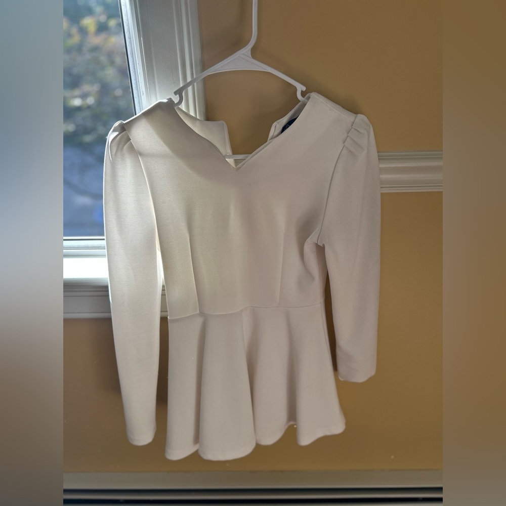 White long sleeve house. Fitted waste with flare bottom.